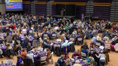 Large crowd in basketball arena for event